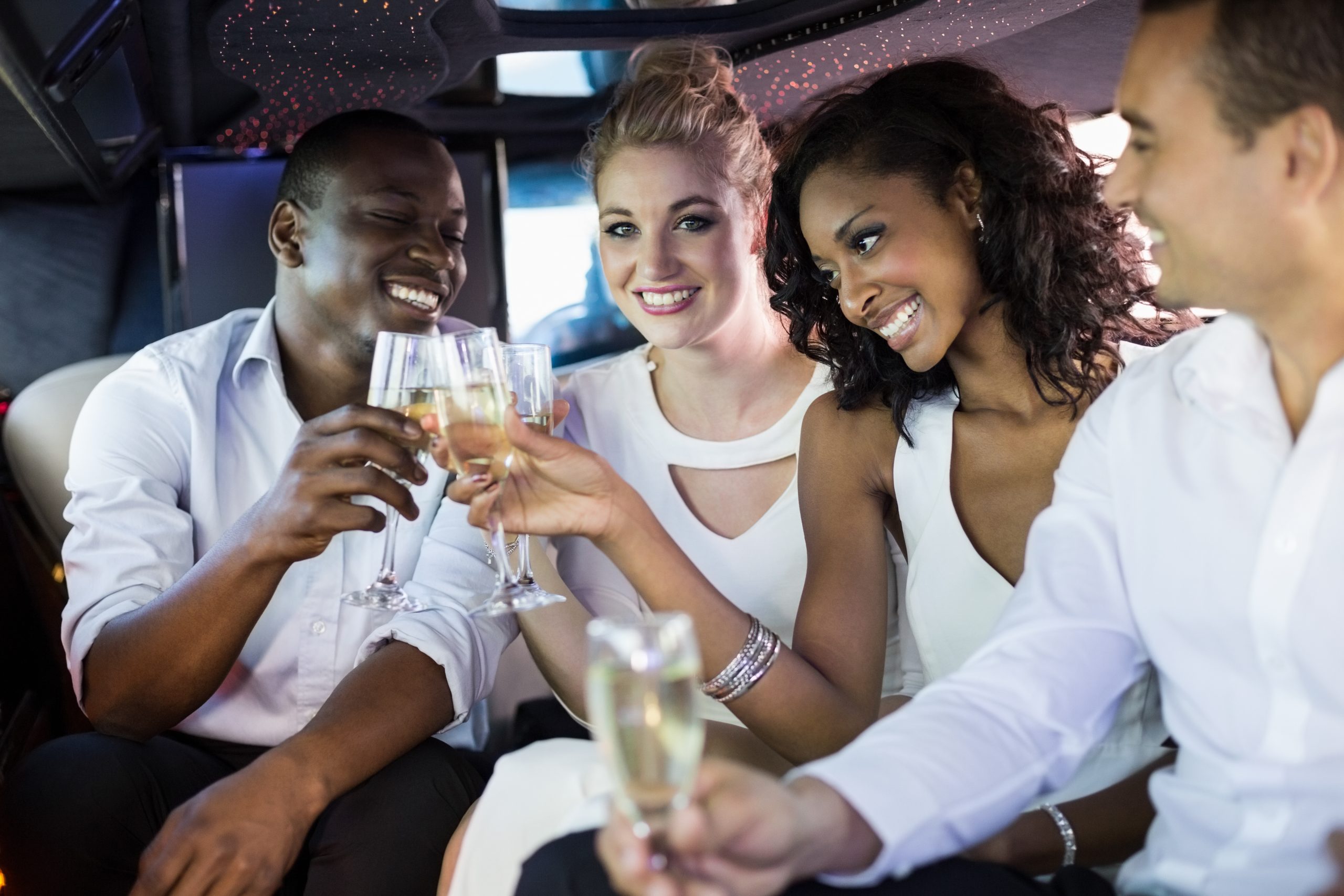 People drink wine in limo
